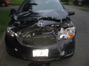 a 2007 Toyota Yaris, sustained significant damage to the front end of the vehicle, rendering the vehicle inoperable. The significant impact caused the parked vehicle to be moved approximately 20 feet.