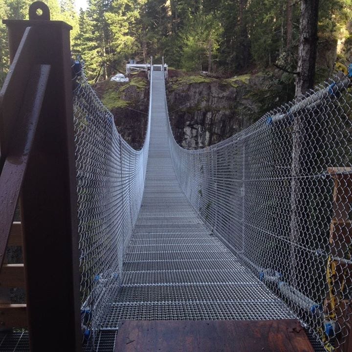 This is what the Elk Falls Suspension Bridge looks like when you are deciding to cross. Go ahead you can do it. See you Saturday May 9th at 10:00 AM for the Grand Opening. Photo by Elk Falls Suspension Bridge Project by the Rotary Club of Campbell River