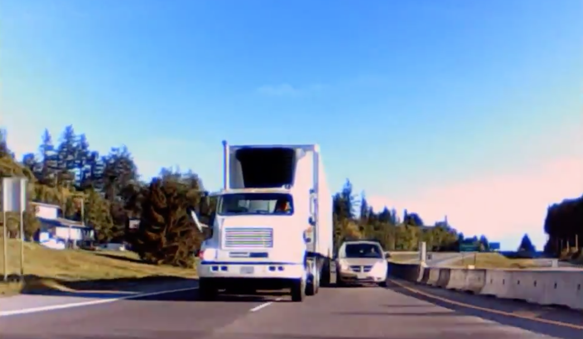 Dashcam footage shows semi-truck swerve dangerously close to vehicle on